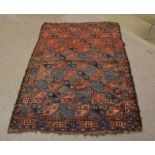 Good quality Bokhara rug decorated predominantly in blue, brown and red with repeating hexagonal