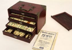 Circa early/mid 20th century wooden cased and metal mounted Mah Jong set with markers and