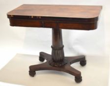 William IV rosewood fold-over card table with green baize lined interior with carved column on a