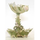 Art Nouveau centrepiece modelled as a lady sitting astride two shells, with a central column with