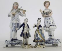 Group of four Continental porcelain figures, late 19th century, one pair modelled as a musician
