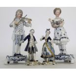 Group of four Continental porcelain figures, late 19th century, one pair modelled as a musician