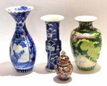 Group of Oriental porcelain items comprising a baluster vase with polychrome decoration and two blue