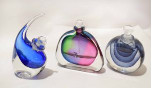 Group of three various coloured glass jars with stoppers, one signed by David Wallis, largest 18cm