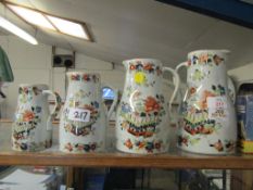 GRADUATED SET OF FOUR VICTORIAN FLORAL PRINTED VASES