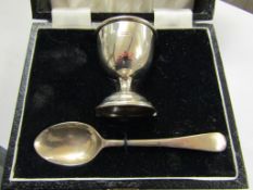 SILVER CASED CHRISTENING EGG CUP AND SPOON