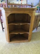 PINE FRAMED WALL MOUNTED CORNER CUPBOARD WITH TWO SHAPED SHELVES