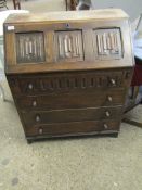 OAK FRAMED OLD CHARM DROP FRONTED BUREAU WITH LINENFOLD DETAIL OVER FOUR FULL WIDTH DRAWERS WITH
