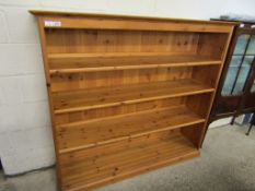 STAINED PINE FRAMED OPEN FRONTED THREE FIXED SHELF BOOKCASE WITH PANEL BACK