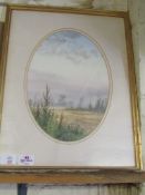 K WALTON OVAL FRAMED WATERCOLOUR OF A LANDSCAPE SCENE