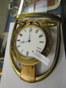 GOOD QUALITY BRASS MANTEL CLOCK FORMED AS A HORSESHOE AND STIRRUP WITH ENAMELLED ARABIC CHAPTER RING