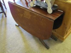 19TH CENTURY MAHOGANY DROP LEAF TABLE WITH EXTENDING SABRE LEGS SUPPORTED BY SIX TURNED COLUMNS