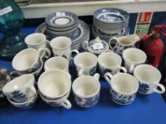 QUANTITY OF BROADHURST OLD WILLOW PATTERN PLATES, CUPS, SAUCERS ETC