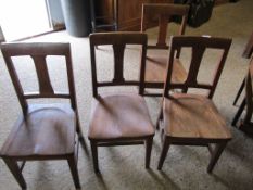 EARLY 20TH CENTURY SET OF FOUR OAK CHAIRS WITH HARD SEATS AND SPLAT BACKS ON TAPERING SQUARE LEGS