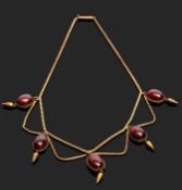 Victorian garnet necklace circa 1860, designed as a fringe of five cabochon garnets, each with