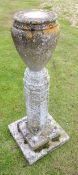 Large weathered cement or composition memorial pedestal, urn shaped top joining a hexagonal column