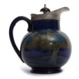 Early 20th century William Moorcroft globular jug with pewter mounts and Bakelite knop, the