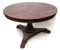 William IV period rosewood circular dining table, the top inset with brass circlets with a beaded