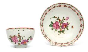 Lowestoft tea bowl and saucer circa 1780, decorated to the centre with a floral design within a line