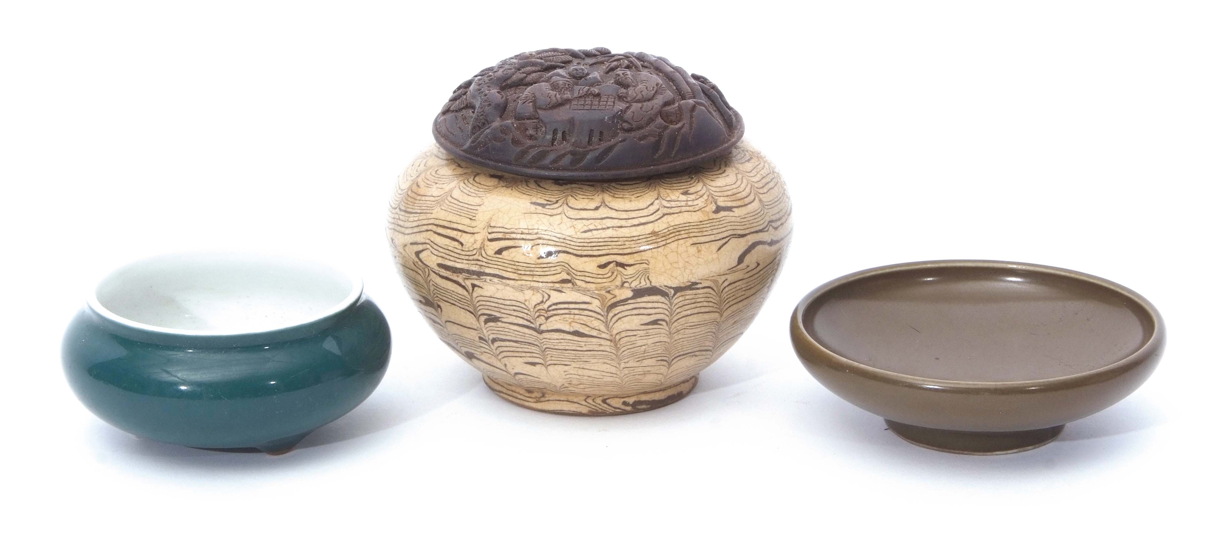 Three pieces of Chinese pottery and porcelain comprising an agate style pottery bowl and wooden