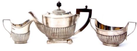 George V three piece tea set comprising tea pot, sugar basin and milk jug, Sheffield 1910/11,