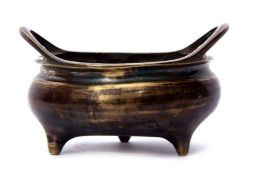 Chinese bronze censer with loop handles standing on three stud feet, impressed reign mark to base,