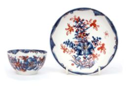 Lowestoft porcelain tea bowl and saucer circa 1780, the blue and white design clobbered with a