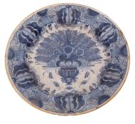 Dutch Delft charger decorated in a blue and white design in Chinese porcelain style within a