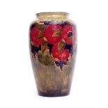 Early 20th century Moorcroft vase decorated with the Pomegranate pattern on green ground, signed