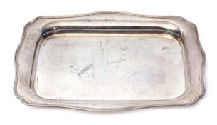 George V dressing table tray of shaped rectangular form with applied rim and polished field, width