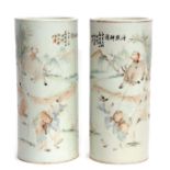 A pair of early 20th century Chinese porcelain vases of cylindrical form, with enamelled