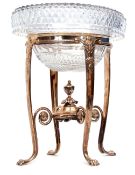 Mid-19th century silver on copper table centrepiece, the oval stand set with four paw legs united by