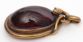 Mid-Victorian garnet and snake pendant, a design featuring a snake coiled around a large oval