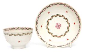 Lowestoft tea bowl and saucer circa 1780, with a polychrome design and alternating wavy border in
