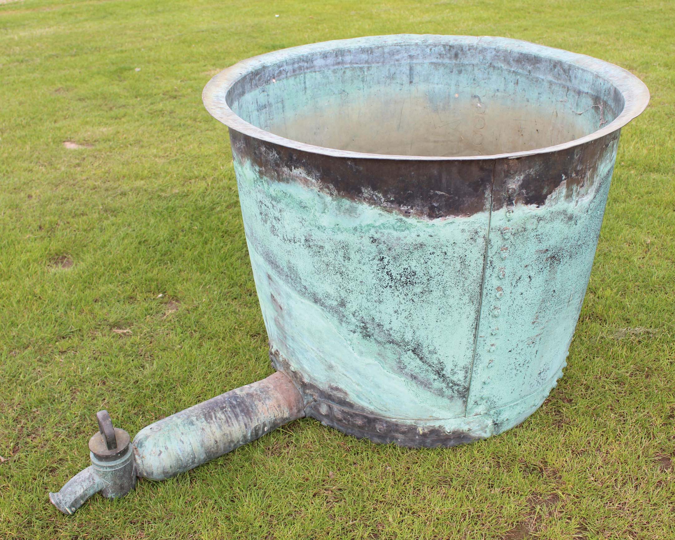 A large vintage copper tank/vat with cast or bronze tap, probably from a brewery 103cm diam 80cm