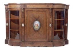 Victorian walnut credenza of break front form, the central door applied with a painted Sevres