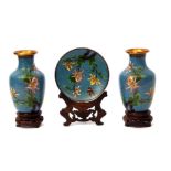 Pair of Japanese cloisonne vases with enamelled decoration of flowers on blue ground, together