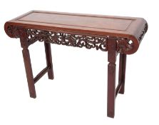 Oriental hardwood altar table, rectangular front with curved ends with a scroll pierced front frieze