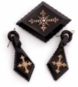 Victorian carved jet mourning brooch and matching earrings circa 1875, each applied with a seed