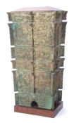 Chinese patinated bronze effect vessel cast in six stepped sections, all with archaistic scroll