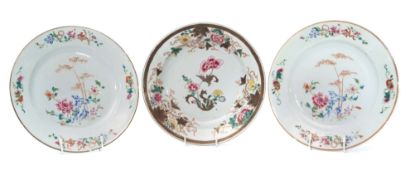 Group of three 18th century Chinese porcelain export plates all decorated in famille rose style with