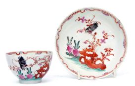 Lowestoft tea bowl and saucer in polychrome decoration in the so-called blackbird pattern, the