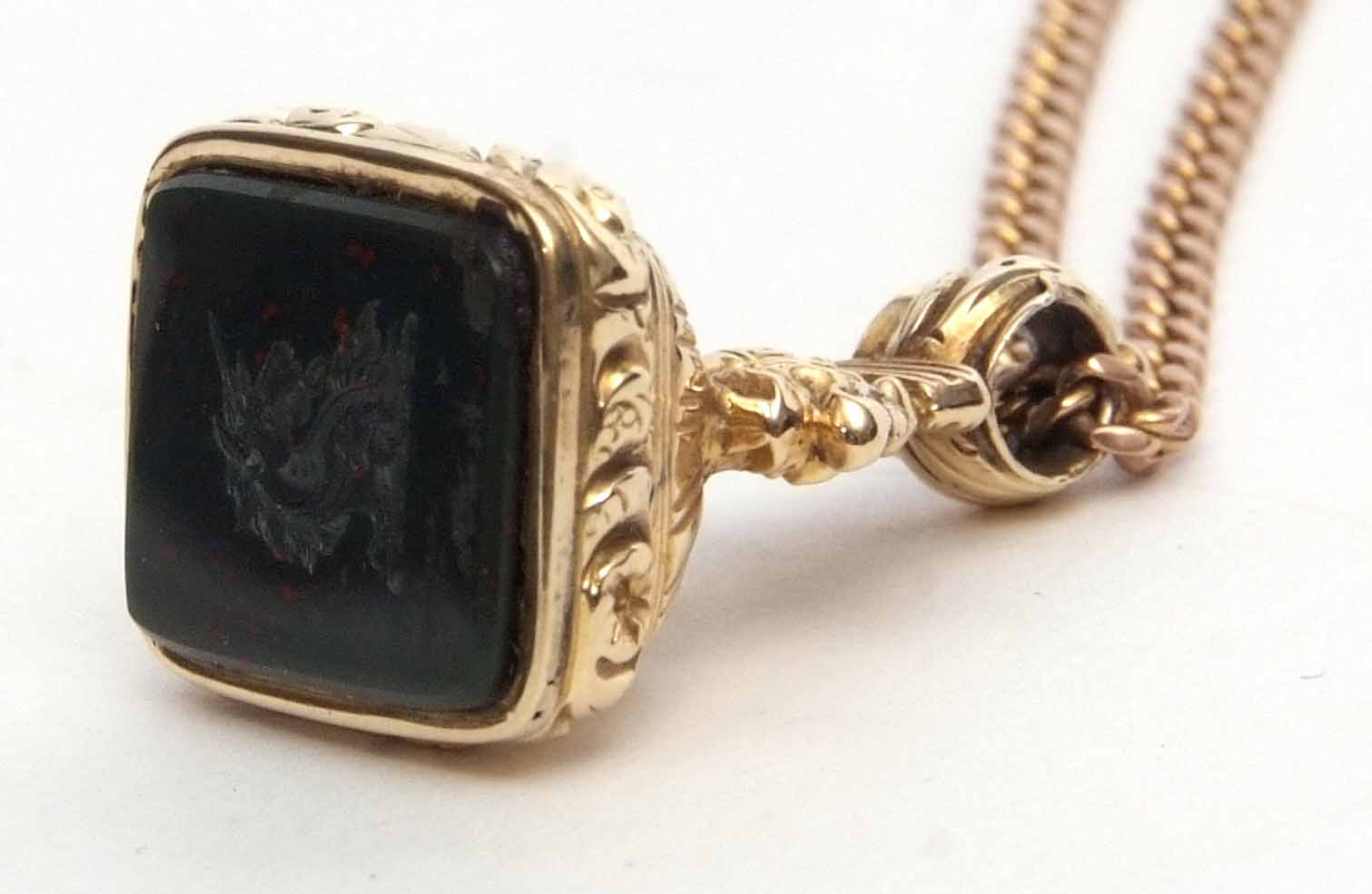 Gold and gold-cased early 19th century bloodstone mounted fob seal, well carved with a profile of - Image 2 of 4