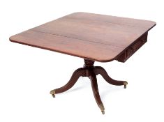 Regency period mahogany pedestal Pembroke table, two drop flaps raised on ring turned baluster