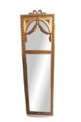 Gilt and gesso rectangular wall mirror crested with a knot pediment and with an arched mirror