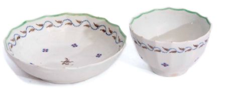 Lowestoft tea bowl and saucer circa 1790, of fluted form decorated with a Chantilly sprig design