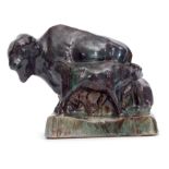 Pottery study of a bison group in mottled brown and green glaze by Stella R Crofts, signed to
