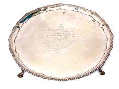 George III circular salver with cast and applied wrythen gadrooned border and mounted on four cast