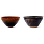 Two Japanese pottery bowls decorated with Tenmoku type glazes, one bowl complete with wooden box