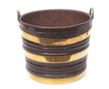 Regency period brass bound mahogany peat bucket of tapering circular form, the top applied with